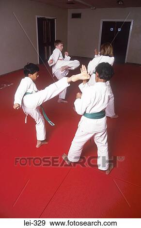 Stock Photo - Boys Practising Karate UK. Fotosearch