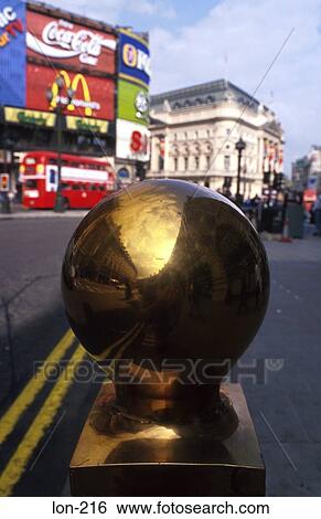 Stock Photograph - Brass Ball on Bollard Piccadilly Circus London UK. Fotosearch