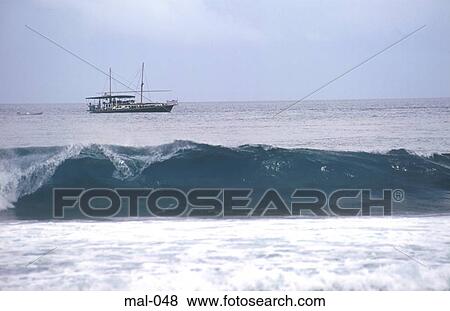 Breaking Waves and Boat Maldives View Large Photo Image Stock Photo - Breaking Waves and Boat Maldives. Fotosearch