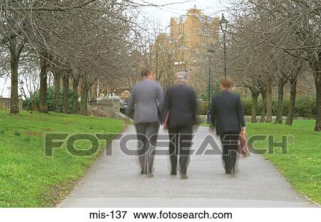 Buisinessmen Walking through Park UK View Large Photo Image Stock Photo - Buisinessmen Walking through Park UK. Fotosearch