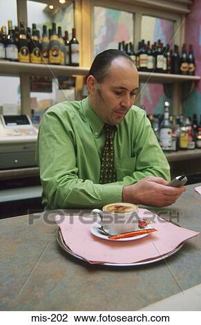 Businessman Dialing on Mobile Phone UK View Large Photo Image Stock Image - Businessman Dialing on Mobile Phone UK. Fotosearch