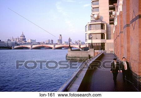 Businessmen Walking by Thames London UK View Large Photo Image Stock Image - Businessmen Walking by Thames London UK. Fotosearch