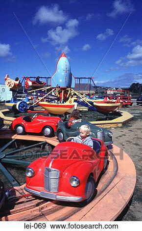 Child in Red Roundabout Car at Fairground View Large Photo Image Stock Photo - Child in Red Roundabout Car at Fairground. Fotosearch