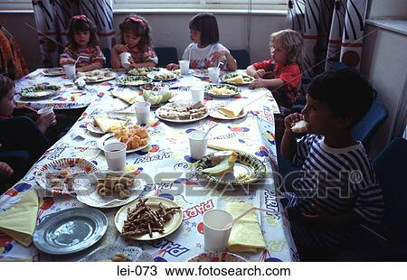 Stock Image - Child's Birthday Tea Party. Fotosearch