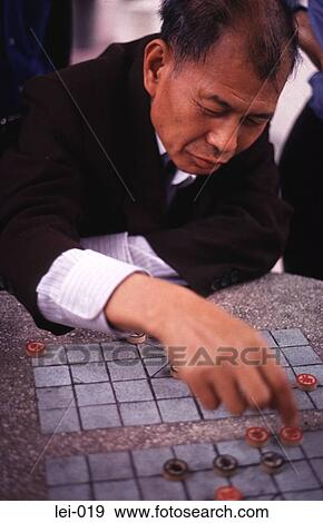 Chinese Man Playing Board Game Hong Kong View Large Photo Image Stock Photo - Chinese Man Playing Board Game Hong Kong. Fotosearch