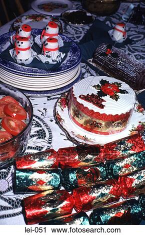Stock Image - Christmas Tea Table with Cakes and Crackers. Fotosearch