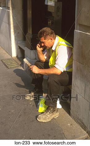 Construction Worker on Mobile Phone London UK View Large Photo Image Stock Image - Construction Worker on Mobile Phone London UK. Fotosearch