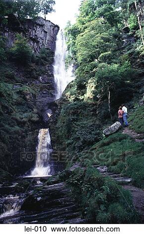 Couple walking by a Waterfall UK View Large Photo Image Stock Image - Couple walking by a Waterfall UK. Fotosearch