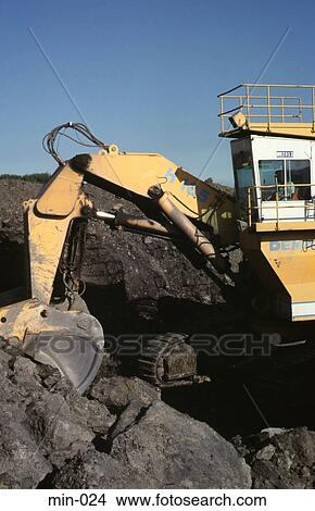 Picture - Digger Scooping Up Coal Trimsaran Mine Wales. Fotosearch