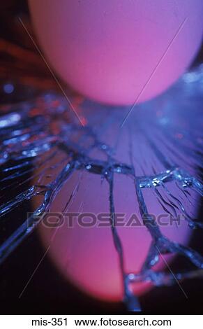 Stock Image - Egg on Cracked Mirror. Fotosearch