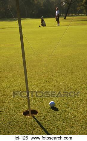 Stock Photography - Golf Ball near Hole. Fotosearch