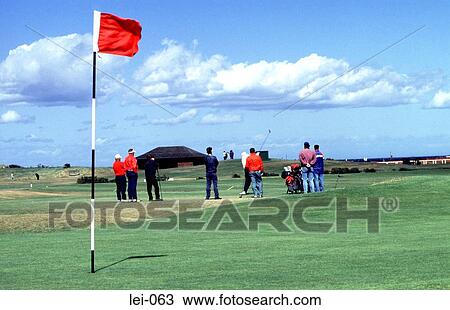 Stock Image - Golfers on the Green at St Andrews Scotland. Fotosearch