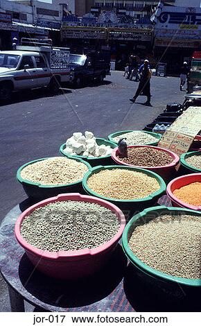 Stock Photo - Grain on Display in Coloured Containers Aqaba Jordan. Fotosearch