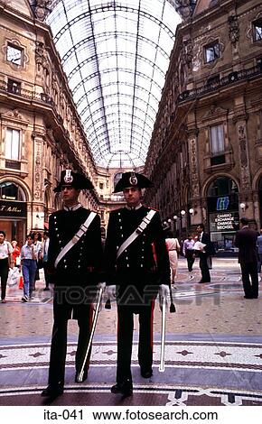 Stock Image - Guards Walking in Galleria Vittorio Emanuele Italy. Fotosearch