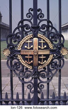 Stock Photograph - Ironwork Crest on Royal Naval College Gate London UK. Fotosearch