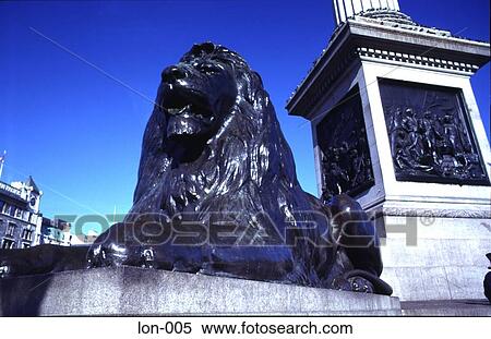 Stock Photography - Lion Statue at the Base of Nelson's Column London UK. Fotosearch
