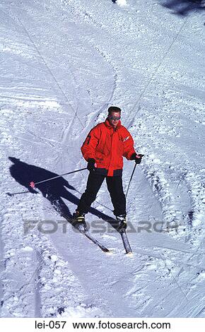Stock Photo - Lone Male Skier on Snow Slope. Fotosearch