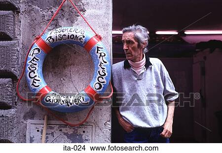 Man by Lifebuoy in Italy Europe View Large Photo Image Picture - Man by Lifebuoy in Italy Europe. Fotosearch