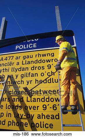 Man Changing Motorway Sign Wales UK View Large Photo Image Stock Photograph - Man Changing Motorway Sign Wales UK. Fotosearch