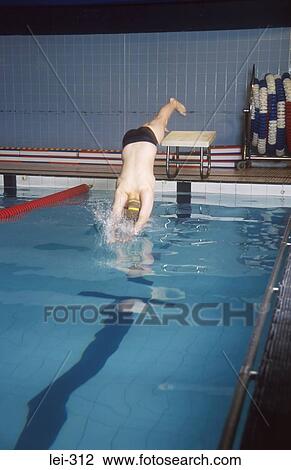 Man Diving into Swimming Pool UK View Large Photo Image Stock Image - Man Diving into Swimming Pool UK. Fotosearch