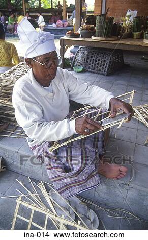 Picture - Man Making Cane Basket Petitenget Temple Seminyak Bali. Fotosearch