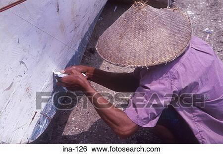 Man Mending Boat on Kelan Beach Bali View Large Photo Image Stock Photograph - Man Mending Boat on Kelan Beach Bali. Fotosearch