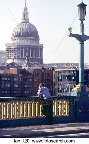 Man On Bridge with St Pauls in Background London UK View Large Photo Image Stock Image - Man On Bridge with St Pauls in Background London UK. Fotosearch