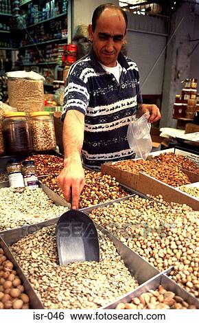 Man Serving Nuts at Carmel Market Tel Aviv Israel View Large Photo Image Stock Photograph - Man Serving Nuts at Carmel Market Tel Aviv Israel. Fotosearch