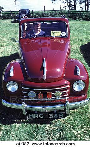 Man Sitting In Vintage Car at Show View Large Photo Image Stock Photo - Man Sitting In Vintage Car at Show. Fotosearch