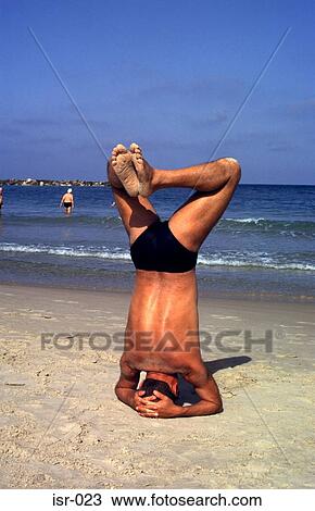 Man Standing on Head on Beach Tel Aviv Israel View Large Photo Image Stock Image - Man Standing on Head on Beach Tel Aviv Israel. Fotosearch