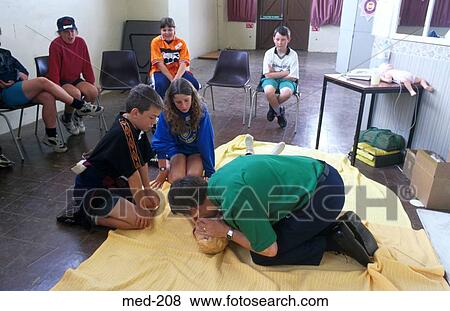 Man Teaching Kiss of Life to School Children View Large Photo Image Stock Photo - Man Teaching Kiss of Life to School Children. Fotosearch