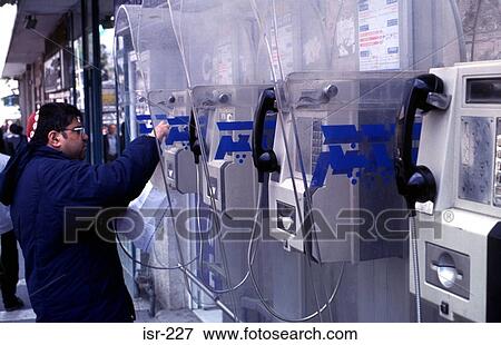 Man Using Public Telephone Rank Jerusalem Israel View Large Photo Image Stock Photo - Man Using Public Telephone Rank Jerusalem Israel. Fotosearch