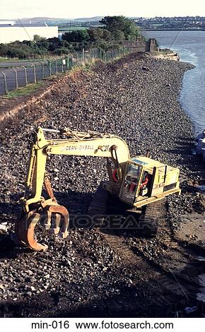 Mechanical Digger Repairing Sea Defences Wales View Large Photo Image Stock Photograph - Mechanical Digger Repairing Sea Defences Wales. Fotosearch
