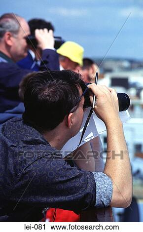 Men Looking Through Binoculars View Large Photo Image Stock Image - Men Looking Through Binoculars. Fotosearch
