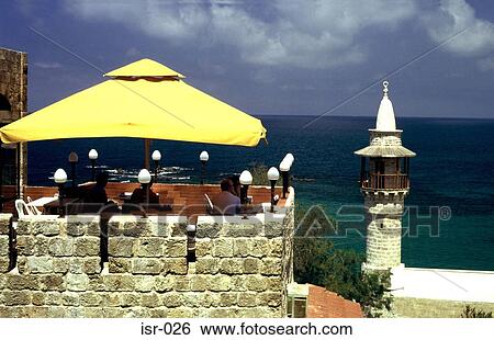 Stock Photograph - Minaret and Rooftop Cafe against Sea Jaffa Israel. Fotosearch