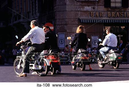 Stock Photo - Moped Riders on Street in Rome Italy. Fotosearch