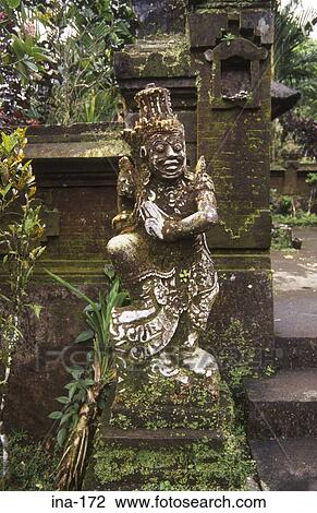 Stock Image - Moss Covered Statue Pura Luhur Batukau Temple Bali. Fotosearch
