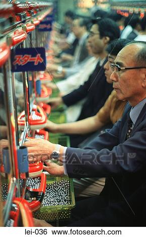Stock Photograph - Old Japanese Man at Pachinko Machine Japan. Fotosearch