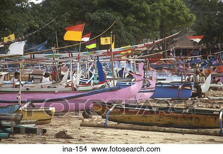 Picture - Painted Wooden Boats on Kelan Beach Bali. Fotosearch