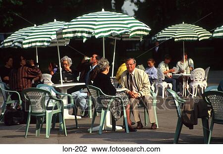 People Sitting at Tables Hyde Park London UK View Large Photo Image Stock Image - People Sitting at Tables Hyde Park London UK. Fotosearch