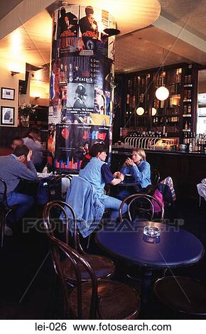 Stock Photograph - People Socialising in a Dublin Bar Ireland. Fotosearch