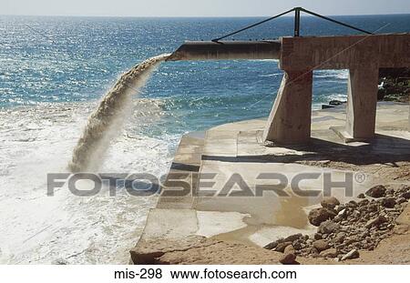Stock Photo - Pipe Discharging into Sea Morocco. Fotosearch
