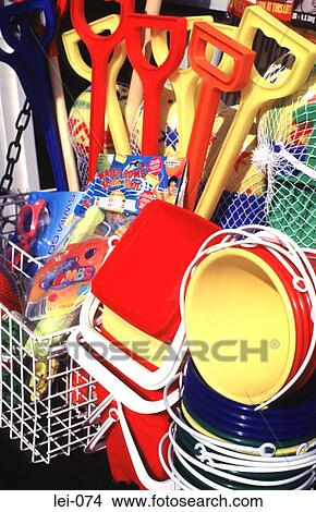 Plastic Buckets and Spades Displayed Outside Shop View Large Photo Image Picture - Plastic Buckets and Spades Displayed Outside Shop. Fotosearch