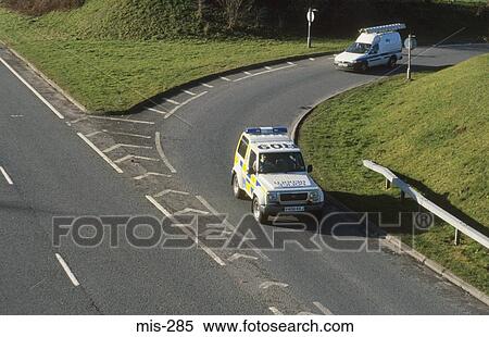 Police Car at Road Junction UK View Large Photo Image Stock Photography - Police Car at Road Junction UK. Fotosearch