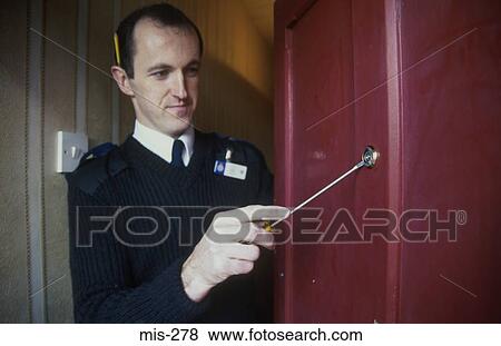 Stock Photo - Policeman Demonstrating Crime Provention UK. Fotosearch