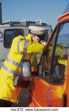 Policeman Inspecting Vehicle Licence UK View Large Photo Image Stock Image - Policeman Inspecting Vehicle Licence UK. Fotosearch