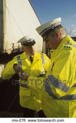 Policeman Inspecting Vehicle Licence UK View Large Photo Image Stock Photograph - Policeman Inspecting Vehicle Licence UK. Fotosearch