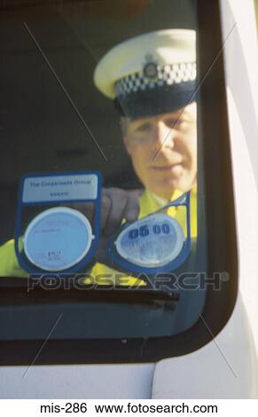Policeman Inspection Vehicle Road Tax Disc UK View Large Photo Image Stock Photograph - Policeman Inspection Vehicle Road Tax Disc UK. Fotosearch