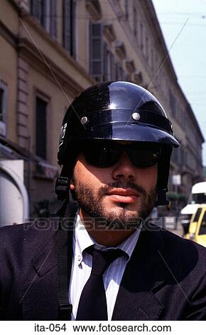 Picture - Portrait of Man in Motorcycle Helmet Milan Italy. Fotosearch