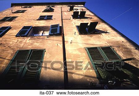 Stock Photo - Red Brick House with Green Shutters Genova Italy. Fotosearch